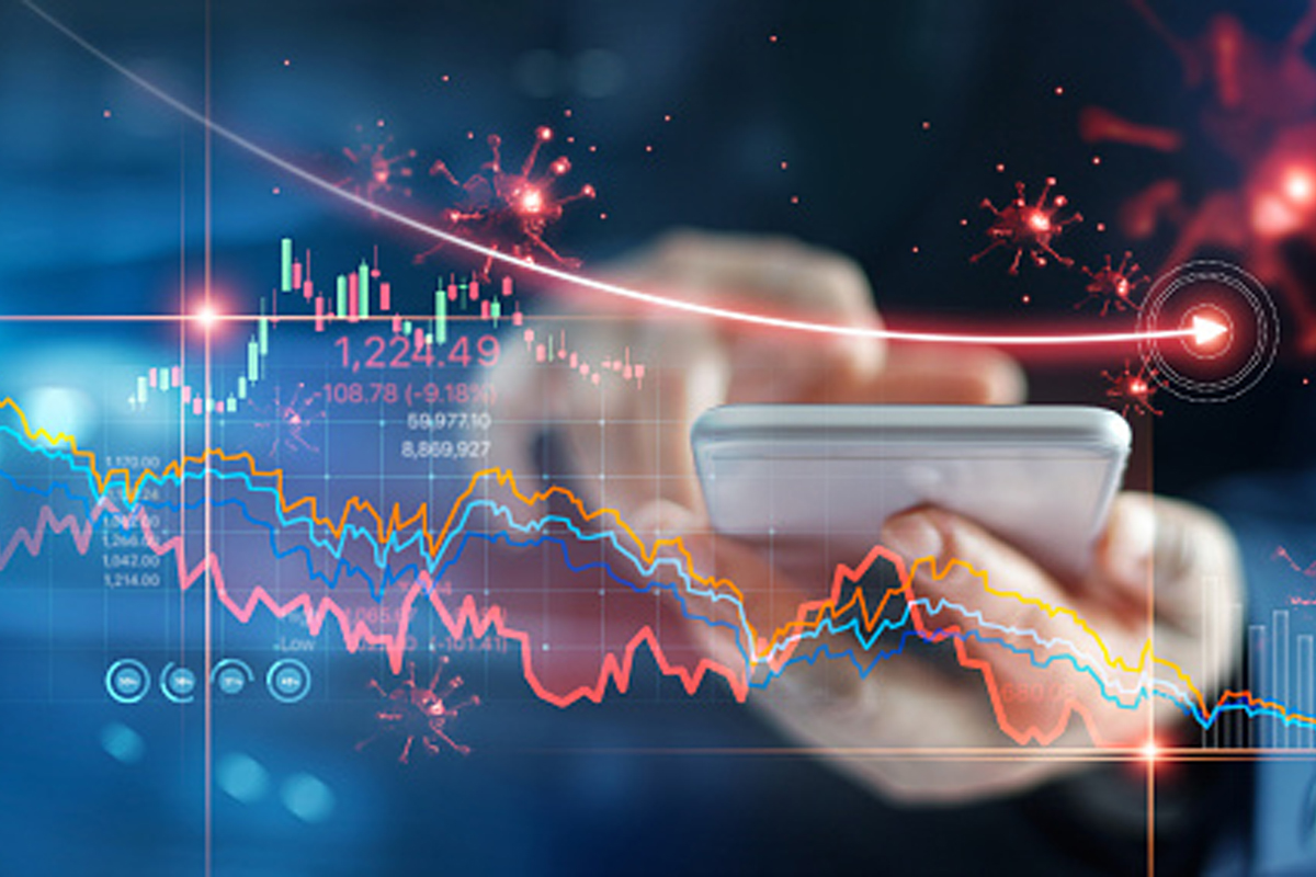 Economic crisis, Businessman using mobile smartphone analyzing sales data and economic graph chart that is falling due to the corona virus crisis, Covid-19, stock market crash caused.