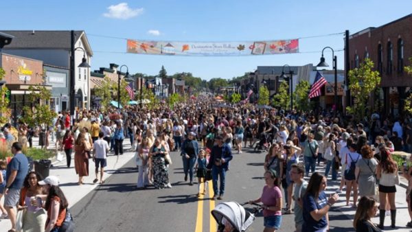 Crowds fill the streets of Downtown Brighton, MI, during the Destination Stars Hallow event