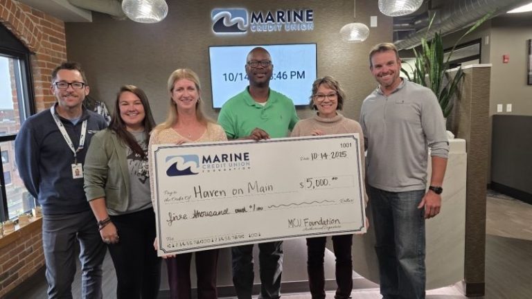 Marine Credit Union Foundation presents a $5,000 check to Couleecap, Inc. in support of an affordable housing project.