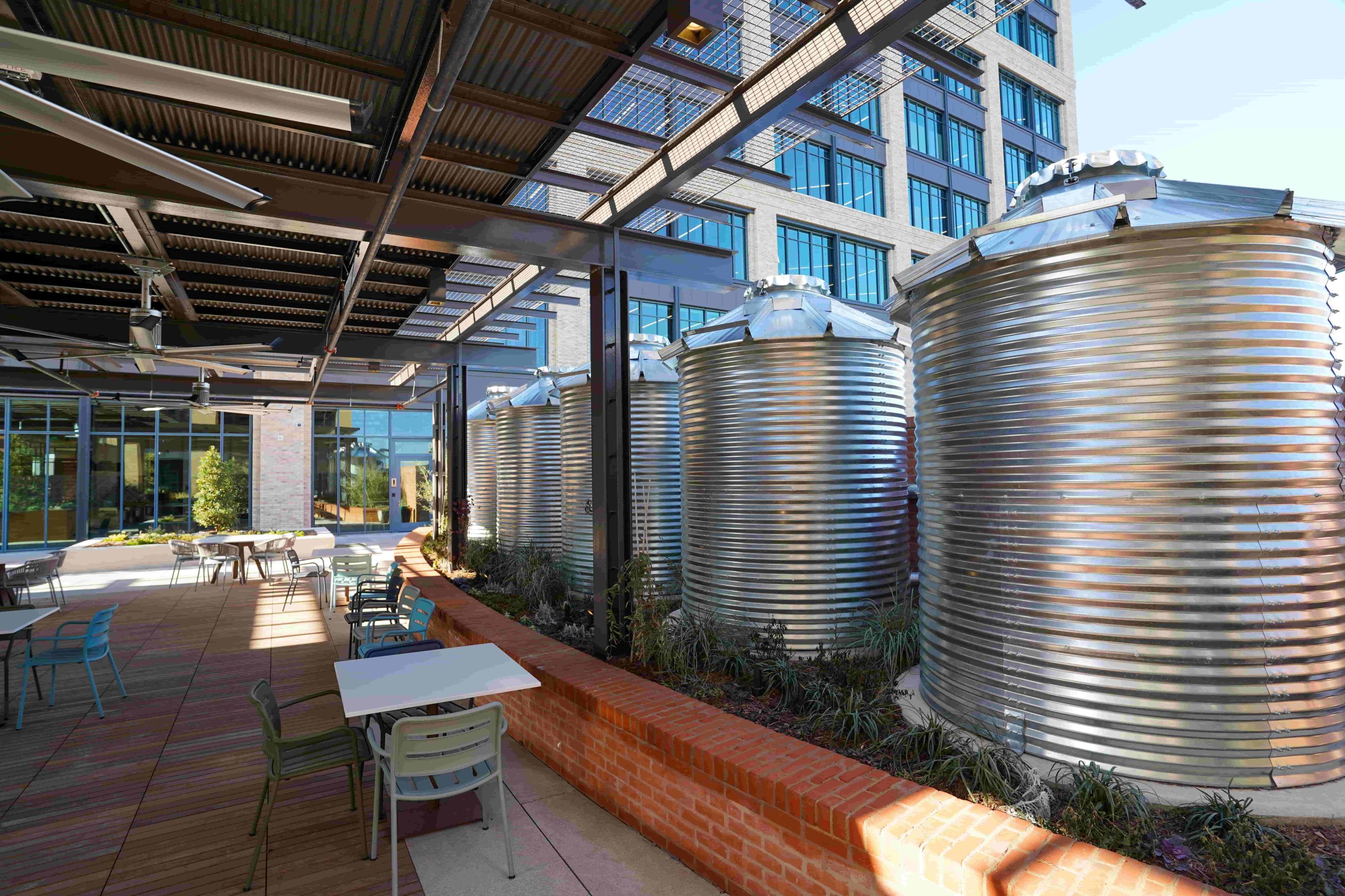  The building uses 97% less potable water than a typical commercial building. Tanks above and below ground can hold 140,000 gallons of rainwater, which the credit union filters and uses to flush toilets and irrigate.