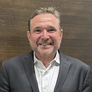 A professional headshot of Mike Dobbins, CEO of Alliant Credit Union.