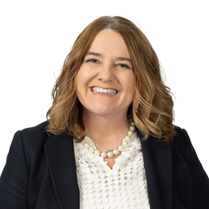 A professional headshot of Vicki Gobble, CFO at Appalachian Community FCU, wearing a dark blazer and patterned blouse, facing forward against a light background.