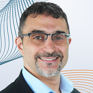 Headshot of Ati Azemoun, vice president of business development at ParaScript, wearing glasses and a dark jacket with a light blue shirt.