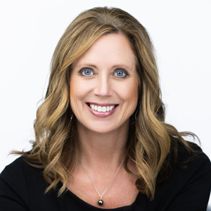 Headshot of Charlotte Nemec, CEO of Canopy Credit Union, against a neutral background.